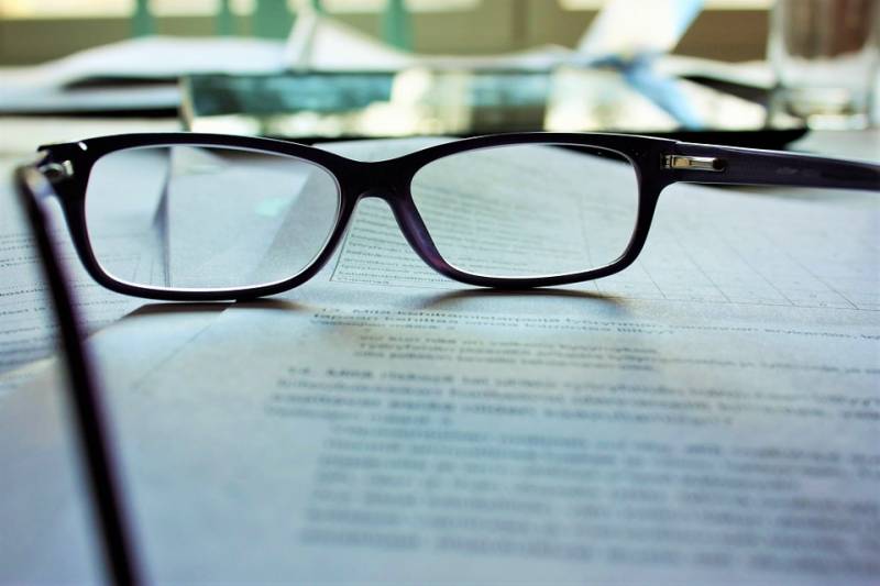 Eye glasses hinges on paper work