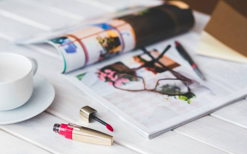 Makeup magazine and glasses