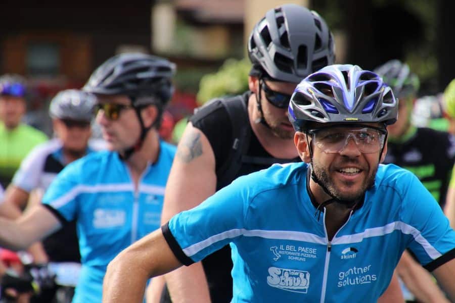 Cyclists wearing sports safety glasses