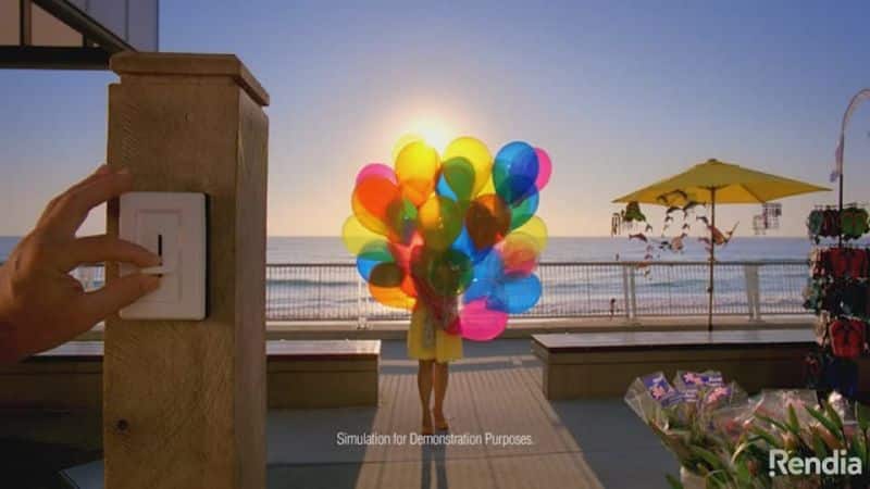 Person with balloons by the ocean transition lens
